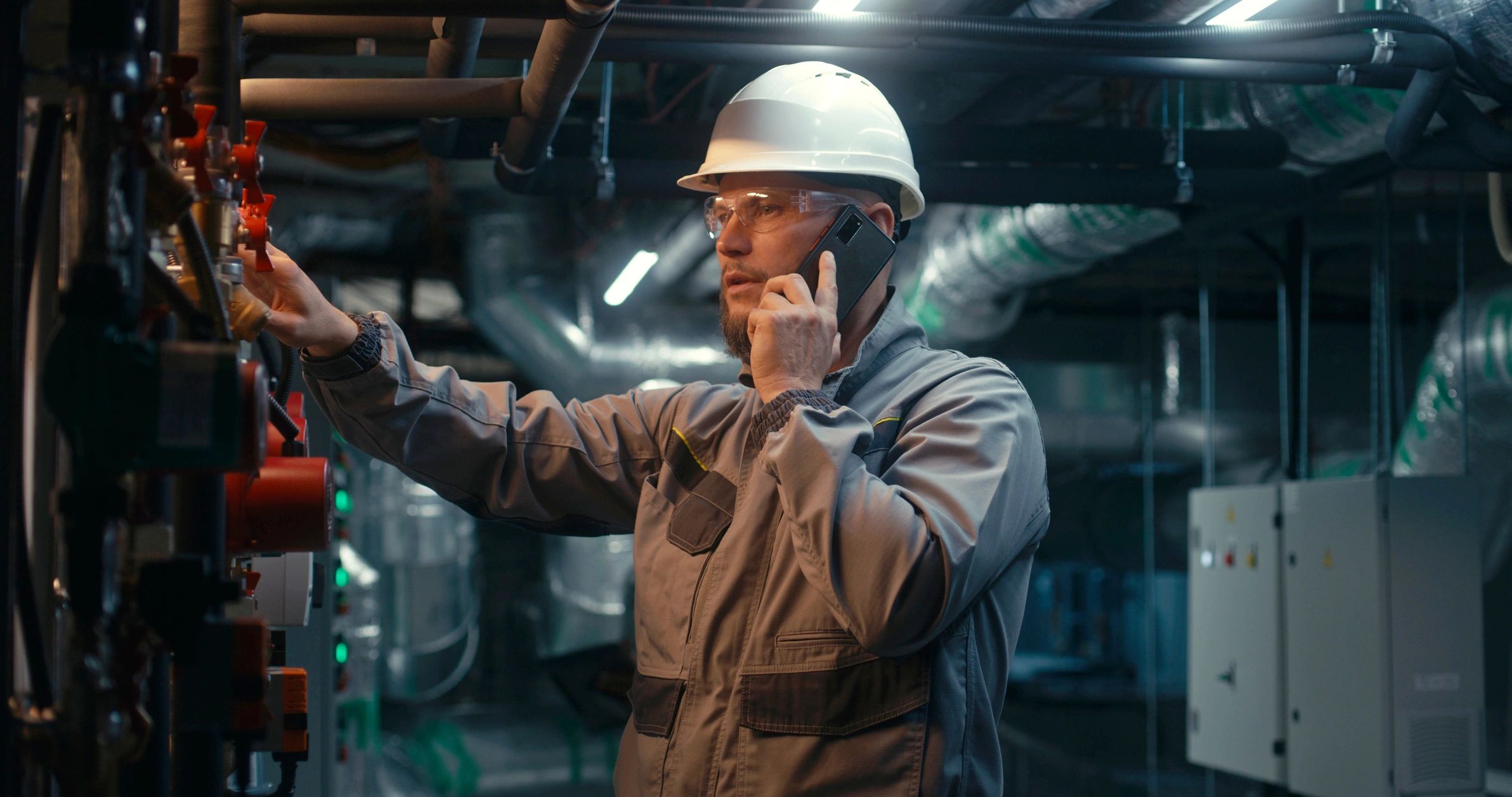 Industrial engineer inspecting pipeline systems