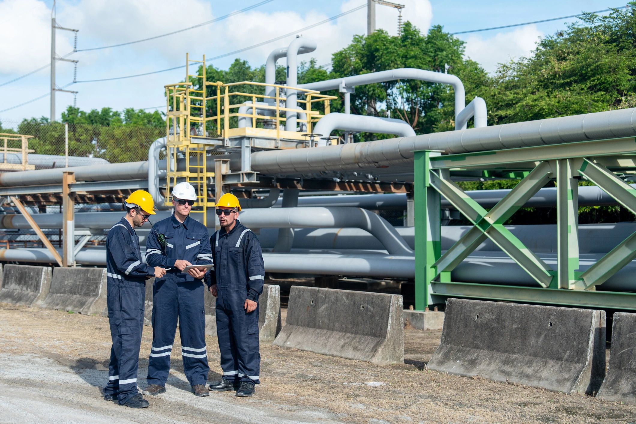 Industrial maintenance team reviewing plant operations